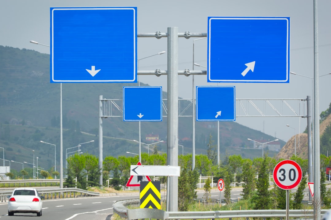 Three road signs pointing in opposite directions, symbolising scattered communication.